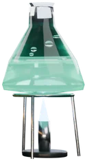 A glass flask of green liquid over a burner